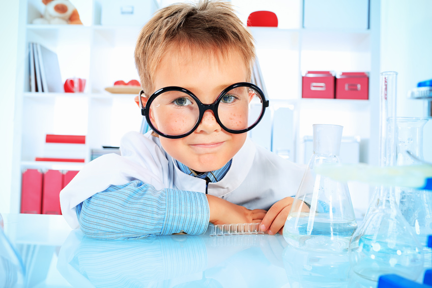 Smiling boy with flasks