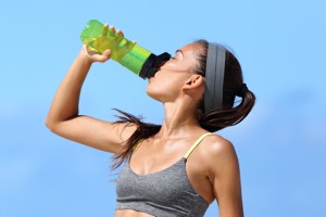 girl drinking from a bottle